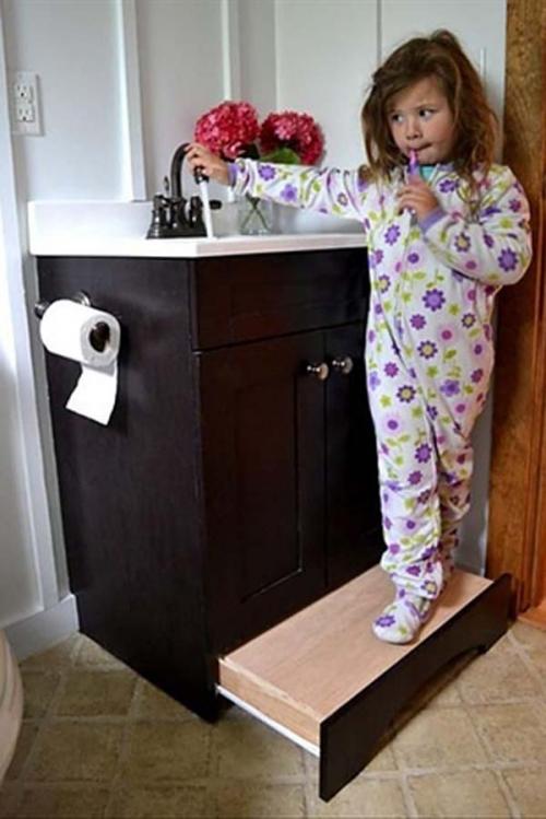 28.) Use a slide-away step in your bathroom instead of a stepstool.