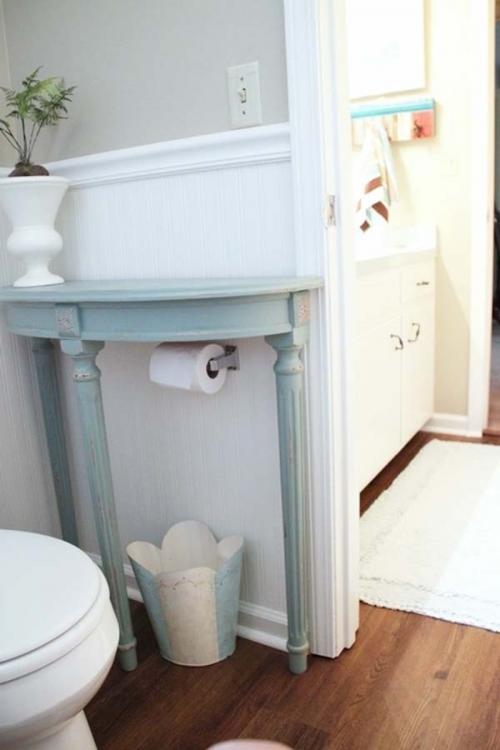 2.) Add a half-table to your bathroom for extra storage space.