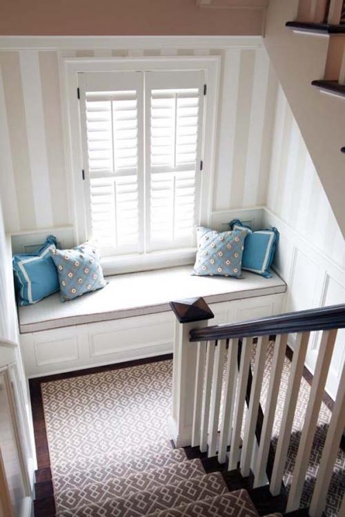 24.) Add a simple window seat to the landing of your staircase.