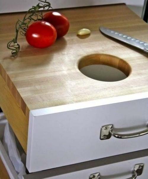 27.) Use kitchen drawers as cutting boards you can hide.