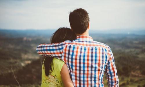 Guy holding girl in arms