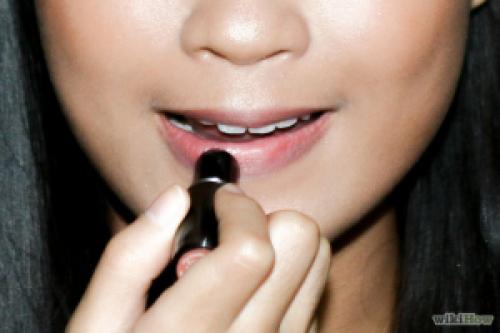 Moisturize your lips by applying chapstick. Use a lip primer to fill up any creases and apply a lip liner, followed by applying a lipstick in the same color as the lip liner and finish with a gloss if you want a glossy look.