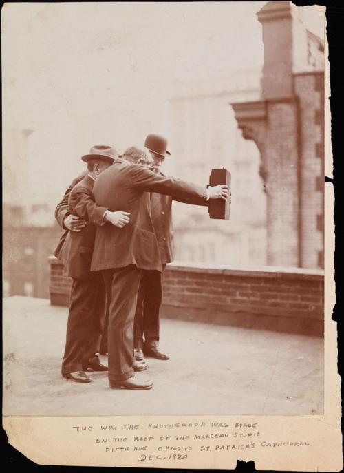 Group taking a selfie photo in 1920.